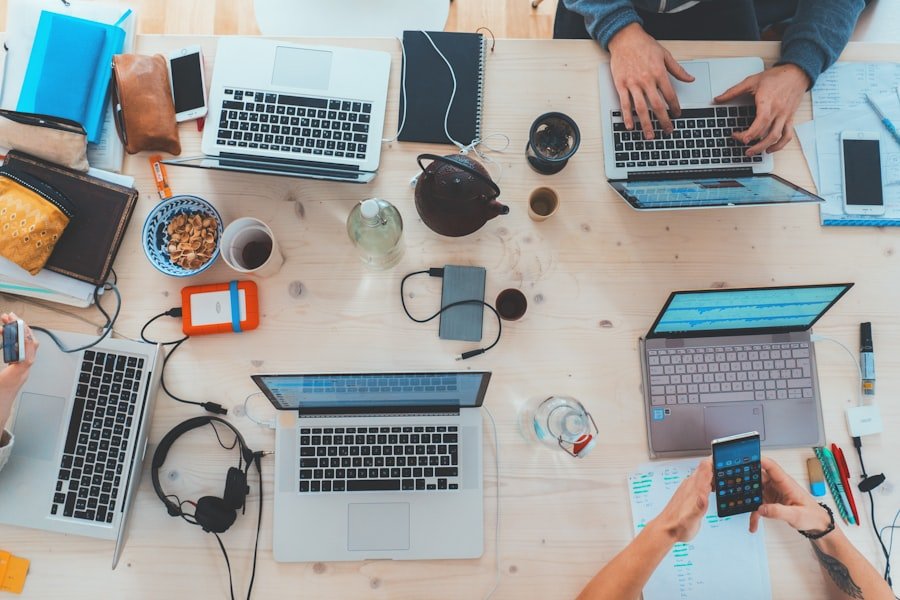 An overhead view of a team working across several devices